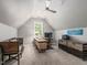 This home office provides a dedicated workspace with good light, neutral colors, and comfortable seating at 445 Ridge Springs Dr, Chapel Hill, NC 27516