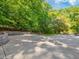 Concrete parking area surrounded by trees at 445 Ridge Springs Dr, Chapel Hill, NC 27516