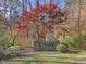 A stone sign for Ridge Springs is surrounded by mature trees at 445 Ridge Springs Dr, Chapel Hill, NC 27516