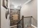 Upstairs hallway features wood accent wall, decorative mirrors, and a skylight for a modern, stylish look at 445 Ridge Springs Dr, Chapel Hill, NC 27516
