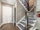 Elegant staircase features wood floors, rod iron railing, and white risers for a classic and sophisticated design at 445 Ridge Springs Dr, Chapel Hill, NC 27516