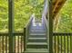 Outdoor wooden stairs with a view of the surrounding trees at 445 Ridge Springs Dr, Chapel Hill, NC 27516