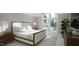 Inviting bedroom with a large window, neutral colors, and recessed lighting at 4500 Latimer Rd, Raleigh, NC 27609