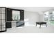 Bonus room featuring a sleek wet bar area and a foosball table for entertainment, with large windows at 4500 Latimer Rd, Raleigh, NC 27609