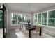 Elegant dining area with large windows providing views of backyard scenery at 4500 Latimer Rd, Raleigh, NC 27609