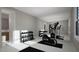 Home gym featuring workout equipment and a mirrored wall at 4500 Latimer Rd, Raleigh, NC 27609