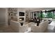 Open living space with fireplace, built-ins, and access to an outdoor patio at 4500 Latimer Rd, Raleigh, NC 27609