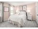 Charming bedroom with a plush bed, soft pink walls, and stylish decor, offering a cozy retreat at 488 Freedom Trail Dr, Angier, NC 27592