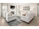 Cozy living room featuring a fireplace, neutral furniture, and stylish decor at 488 Freedom Trail Dr, Angier, NC 27592