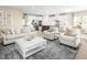 Open concept living room featuring a kitchen and comfortable seating area with patterned rug at 488 Freedom Trail Dr, Angier, NC 27592