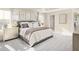 Comfortable main bedroom with a large bed, decorative pillows, and a window with bright natural light at 488 Freedom Trail Dr, Angier, NC 27592