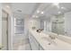 Bathroom featuring a long vanity with double sinks and a large mirror at 50 Tyler Ct, Henderson, NC 27537