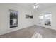 Bright bedroom with neutral walls, carpet, two windows and a ceiling fan at 50 Tyler Ct, Henderson, NC 27537