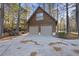Two-car garage with a concrete driveway at 50 Tyler Ct, Henderson, NC 27537