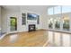 Spacious living area features built-in shelving, a fireplace, and access to the outdoor space at 50 Tyler Ct, Henderson, NC 27537