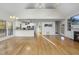 Open-concept living area with hardwood floors connecting the living room to the kitchen at 50 Tyler Ct, Henderson, NC 27537