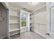 Walk-in closet with built-in shelving and hanging rods at 50 Tyler Ct, Henderson, NC 27537