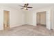 Spacious bedroom with carpet floors and multiple doors, including one to the bathroom at 509 Darby Glen Ln, Durham, NC 27713