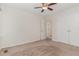 Spacious bedroom with carpet floors, ceiling fan, and a closet at 509 Darby Glen Ln, Durham, NC 27713