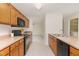 Spacious kitchen featuring modern appliances, ample counter space, and hardwood cabinets at 509 Darby Glen Ln, Durham, NC 27713