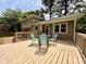 Wooden deck with outdoor seating offering an excellent view of the home's exterior at 509 E Millbrook Rd, Raleigh, NC 27609