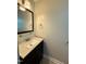 This bathroom features a granite vanity and a framed mirror at 509 E Millbrook Rd, Raleigh, NC 27609
