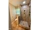 This renovated bathroom features a glass shower with tile surround and a toilet at 509 E Millbrook Rd, Raleigh, NC 27609
