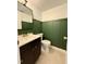 Updated bathroom featuring green board and batten and a vanity at 509 E Millbrook Rd, Raleigh, NC 27609