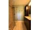 This remodeled bathroom features a glass shower with tile surround at 509 E Millbrook Rd, Raleigh, NC 27609