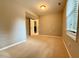 Neutral bedroom features carpet, a window, and a doorway to another room at 509 E Millbrook Rd, Raleigh, NC 27609