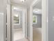 Hallway view featuring bedrooms with a simple layout and neutral color palette at 509 E Millbrook Rd, Raleigh, NC 27609