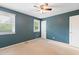 Bedroom features soft carpet and two bright windows at 509 E Millbrook Rd, Raleigh, NC 27609