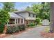 Charming home with a well-manicured yard, brick and siding exterior, and storage shed at 509 E Millbrook Rd, Raleigh, NC 27609