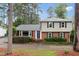 Charming two-story home featuring a brick facade, grey siding, and well-maintained landscaping at 509 E Millbrook Rd, Raleigh, NC 27609