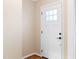 Bright and airy front door with a 6-pane window feature and hardware at 509 E Millbrook Rd, Raleigh, NC 27609