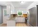 Updated kitchen featuring stainless steel appliances, ample cabinet space, and a granite countertop at 509 E Millbrook Rd, Raleigh, NC 27609