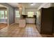 Bright kitchen featuring white cabinets, stainless steel appliances, and granite countertops at 509 E Millbrook Rd, Raleigh, NC 27609