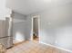 Bright eat-in kitchen area featuring stainless steel refrigerator and an open entranceway at 509 E Millbrook Rd, Raleigh, NC 27609