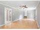 Open living room area with new floors, neutral paint, and open staircase to the upper level at 509 E Millbrook Rd, Raleigh, NC 27609