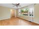 Charming living room featuring hardwood floors and large windows with lots of natural light at 509 E Millbrook Rd, Raleigh, NC 27609