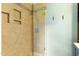 Beautiful glass enclosed shower with built in niches and stylish tile work, perfect for relaxation at 509 E Millbrook Rd, Raleigh, NC 27609