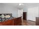 Comfortable bedroom with wood floors and a double door closet, offering storage and style at 5416 Whisperwood Dr, Durham, NC 27713