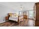 Spacious bedroom with tray ceiling, ceiling fan, and abundant natural light at 5416 Whisperwood Dr, Durham, NC 27713
