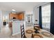 Cozy dining area with wooden table and chairs, adjacent to kitchen and living area at 5416 Whisperwood Dr, Durham, NC 27713