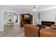 Open-concept living room with hardwood floors and an archway leading to the dining area at 5416 Whisperwood Dr, Durham, NC 27713