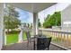 Charming patio with outdoor seating overlooking a well-maintained backyard and neighborhood at 5416 Whisperwood Dr, Durham, NC 27713