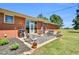 Cozy back patio with furniture, seamlessly blending indoor and outdoor living spaces at 585 Cokesbury Rd, Fuquay Varina, NC 27526