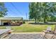 Open backyard featuring an outdoor structure with plenty of room to unwind and entertain at 585 Cokesbury Rd, Fuquay Varina, NC 27526