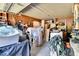 Cluttered garage filled with an assortment of items, offering storage and workspace potential at 585 Cokesbury Rd, Fuquay Varina, NC 27526