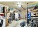 Garage cluttered with tools and equipment, perfect for hobbies and storage, offering functional space at 585 Cokesbury Rd, Fuquay Varina, NC 27526